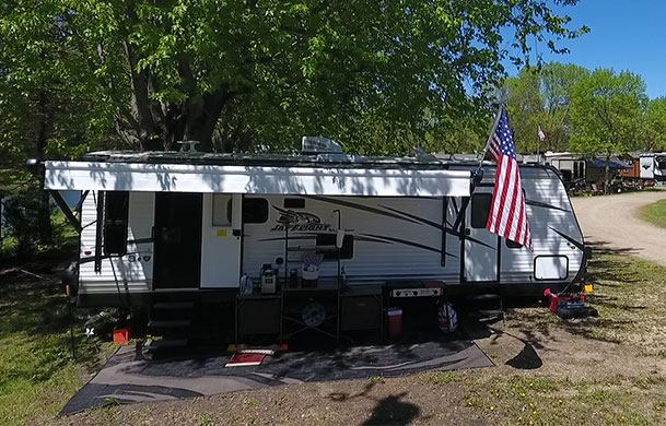 Pull-through RV site with full hookups at Beaver Trails